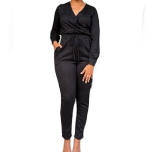 JUMPSUIT. Long sleeve. Black. V-neck. Tie waist. NWOT